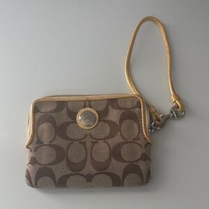 Coach Signature brown and cream canvas wristlet with gold-tone